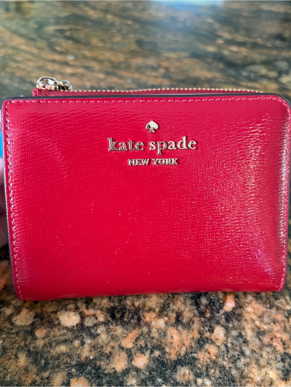 kate spade vibrant red patent leather zip wallet with gold logo